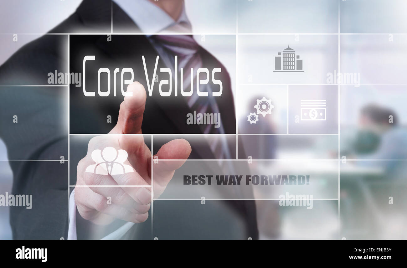 Businessman pressing a Core Values concept button Stock Photo - Alamy