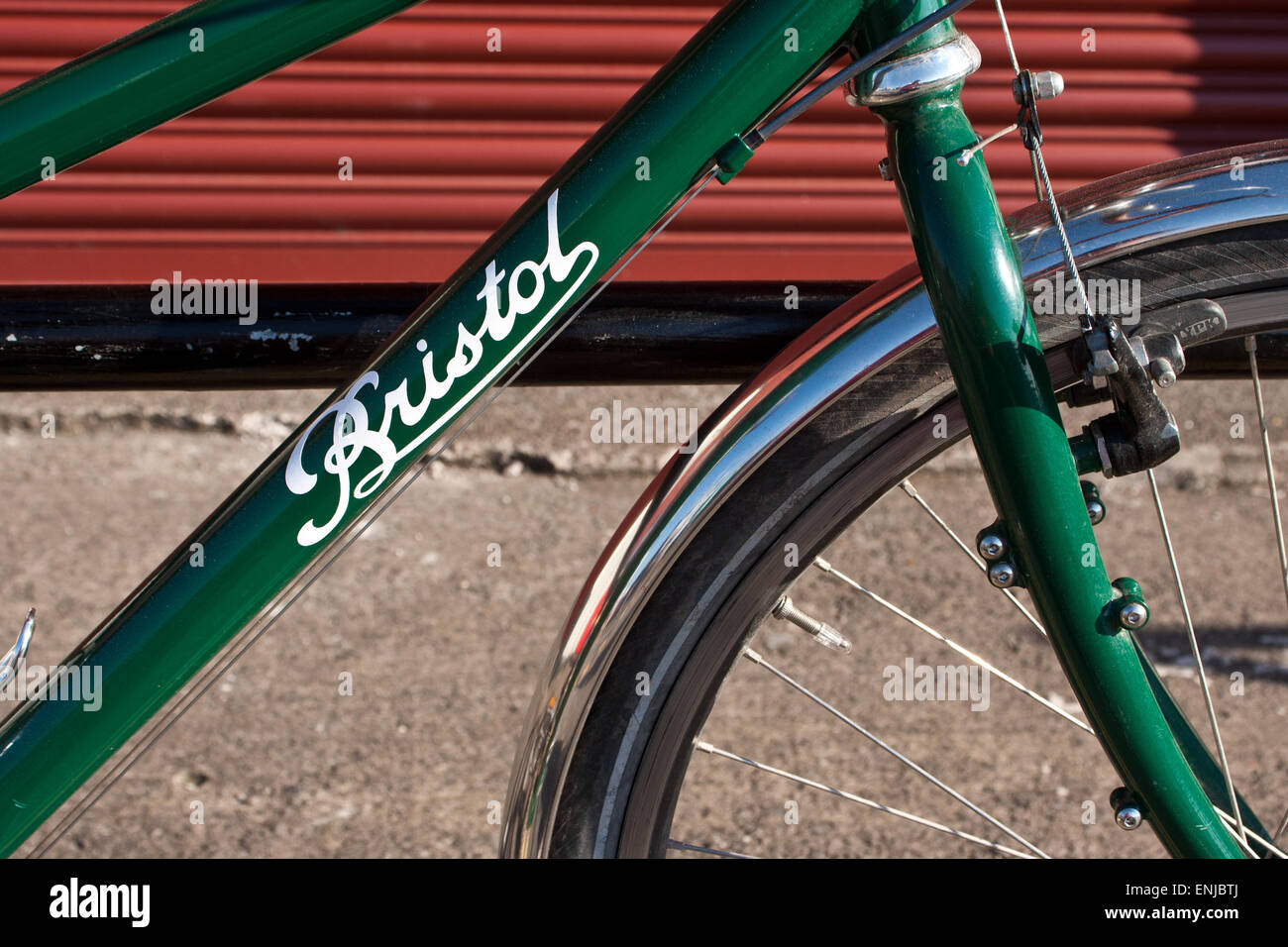 A green bicycle parked in Bristol, England's first 'cycling city' Stock Photo