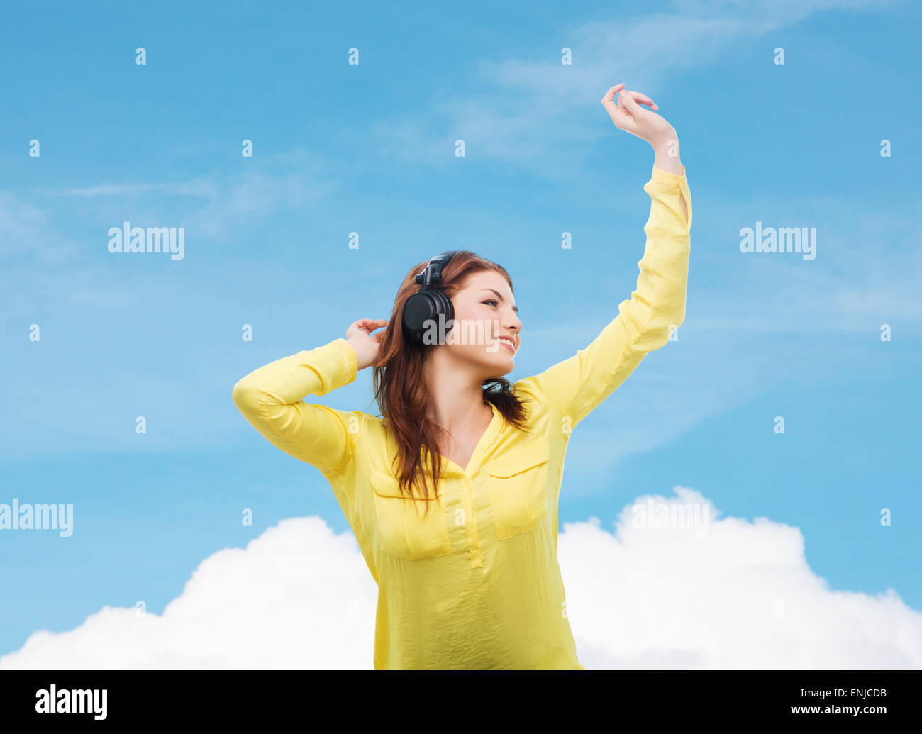teenage girl sitting on sofa with headphones Stock Photo - Alamy