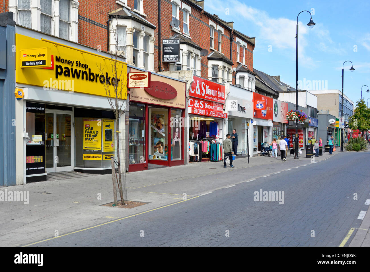 Money shop pawnbroker store & other small shop units in East Ham pedestrianised high street (except for buses) Newham East London England UK Stock Photo