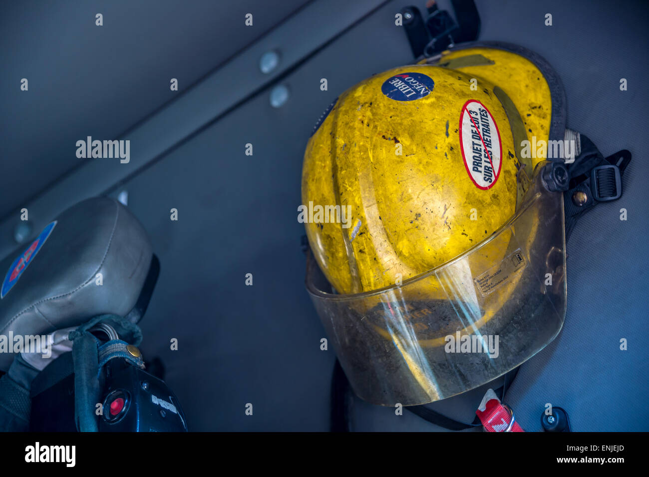 Montreal fireman helmet in a firetruck Stock Photo