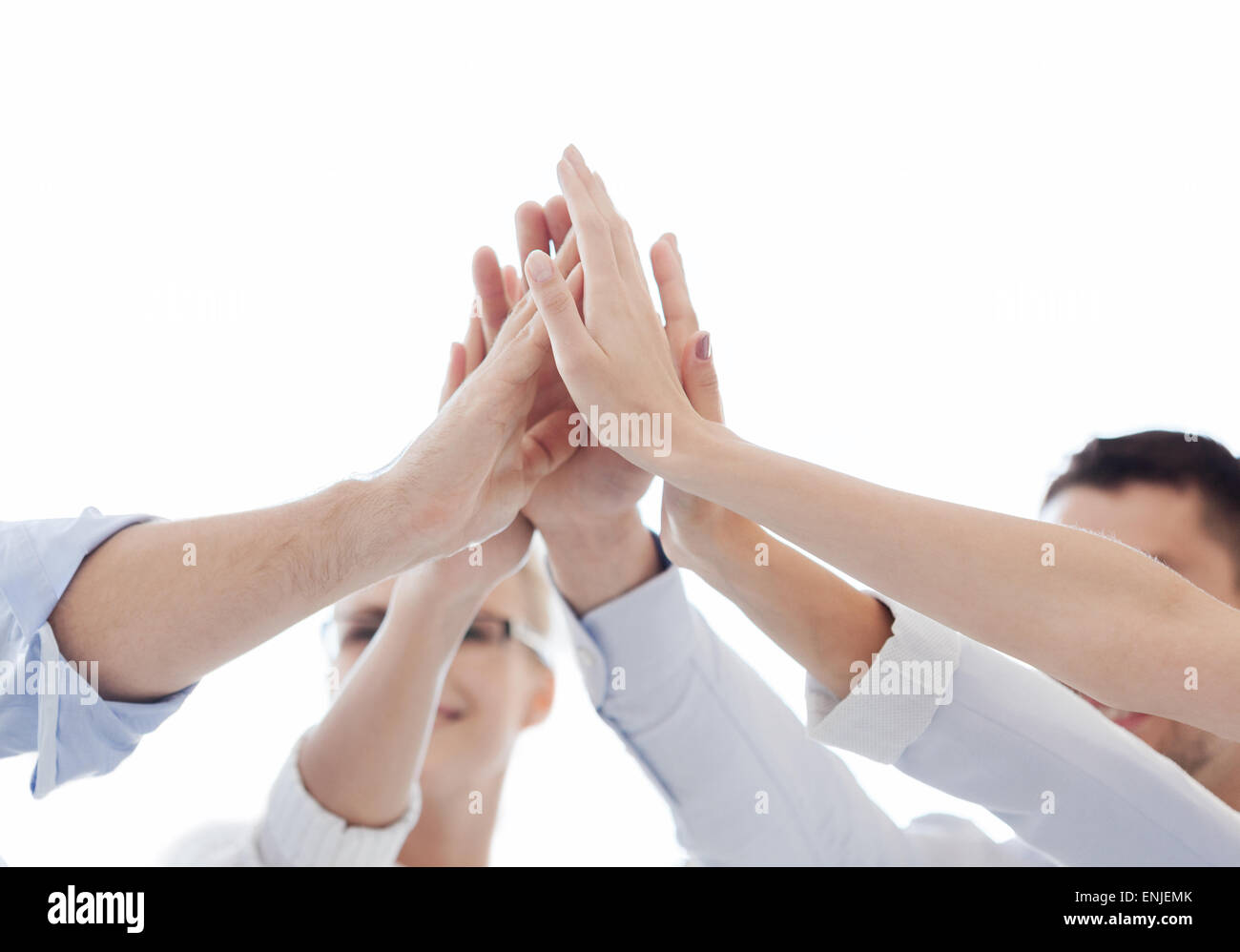 happy business team giving high five in office Stock Photo - Alamy