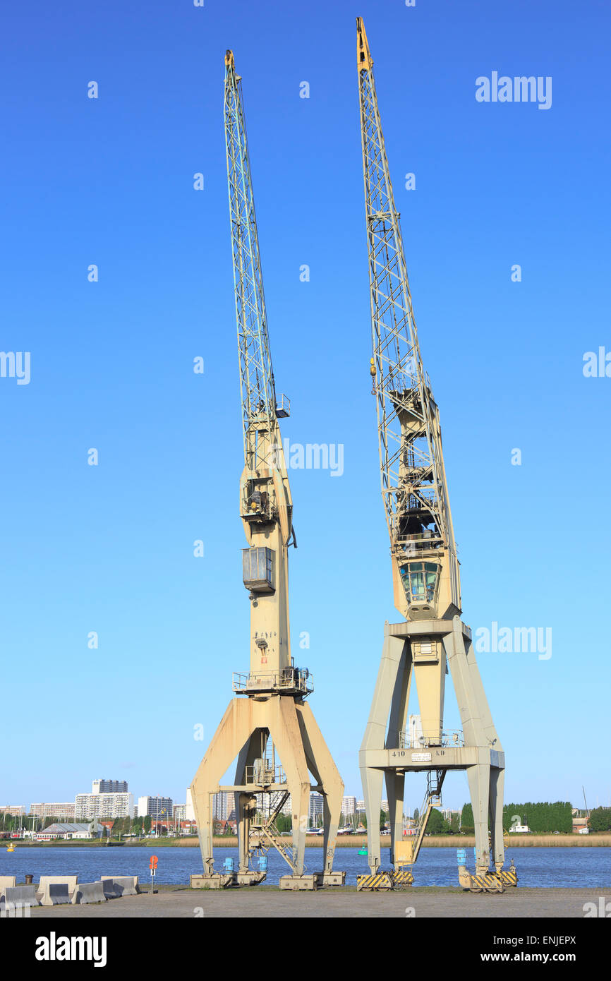 Two types of cranes at an open-air museum that were used in the Port of Antwerp, Belgium Stock Photo