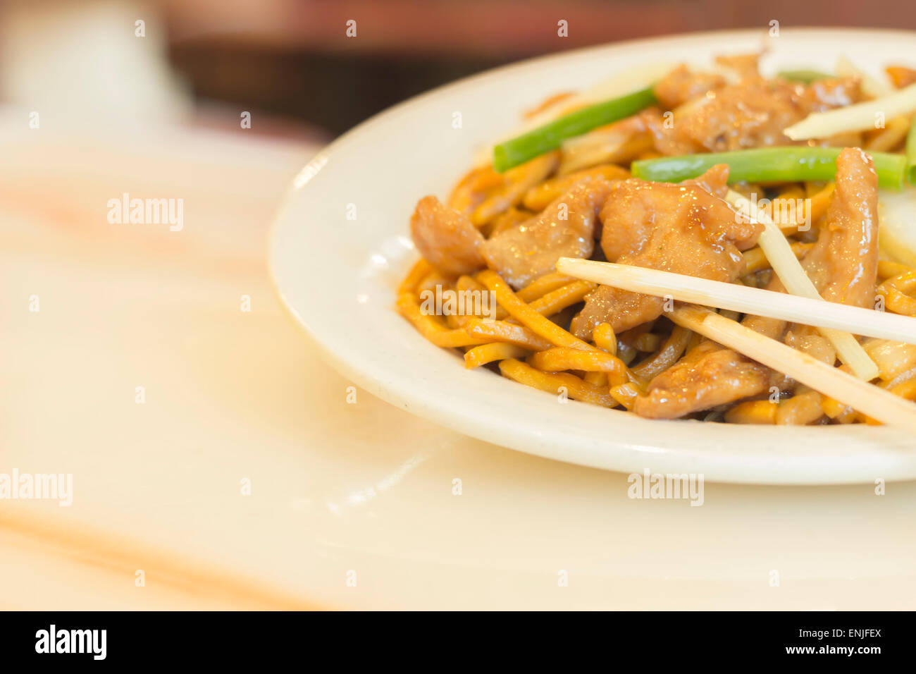 Authentic Chinese chicken lo mein noodles at a restaurant Stock Photo