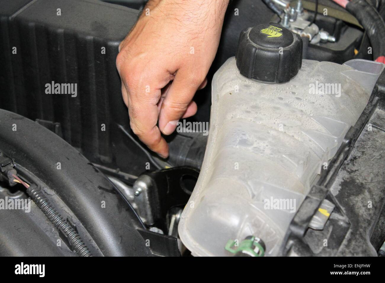car mechanic repairs a motor vehicle Stock Photo