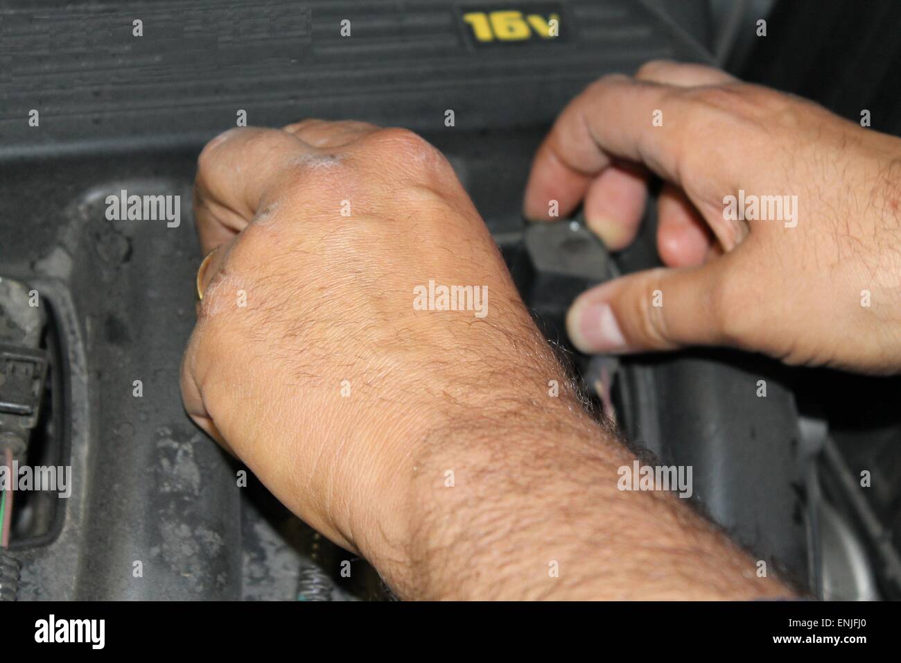 car mechanic repairs a motor vehicle Stock Photo