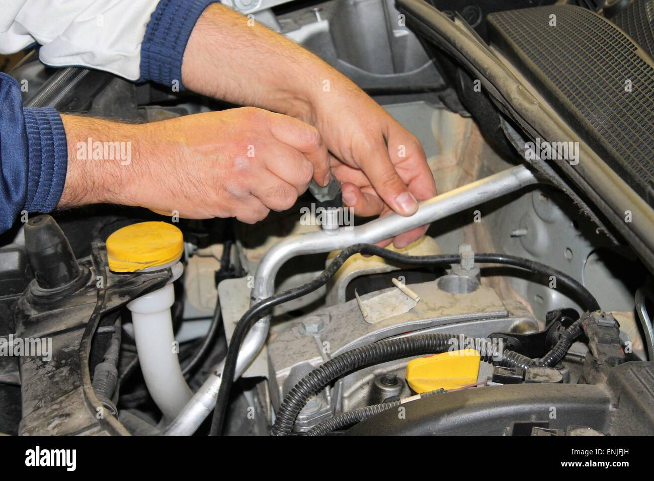 car mechanic repairs a motor vehicle Stock Photo