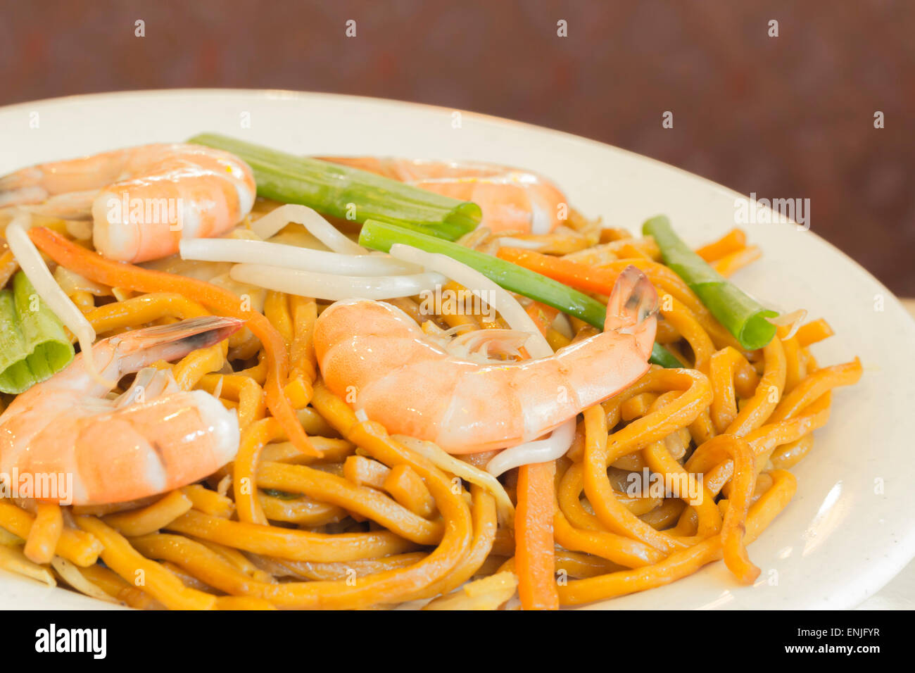 Authentic Chinese Shrimp lo mein noodles at a restaurant Stock Photo