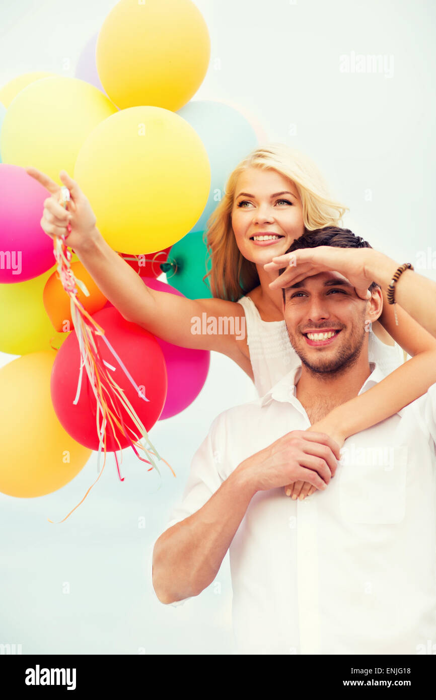 Romantic couple holding balloons hi-res stock photography and images ...