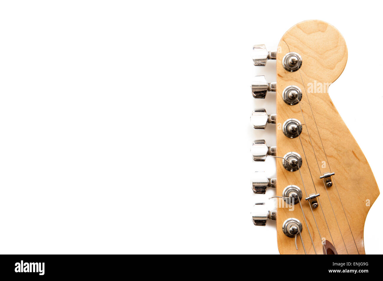 Electric guitar wooden color headstock and tuning peg detail isolated on white Stock Photo