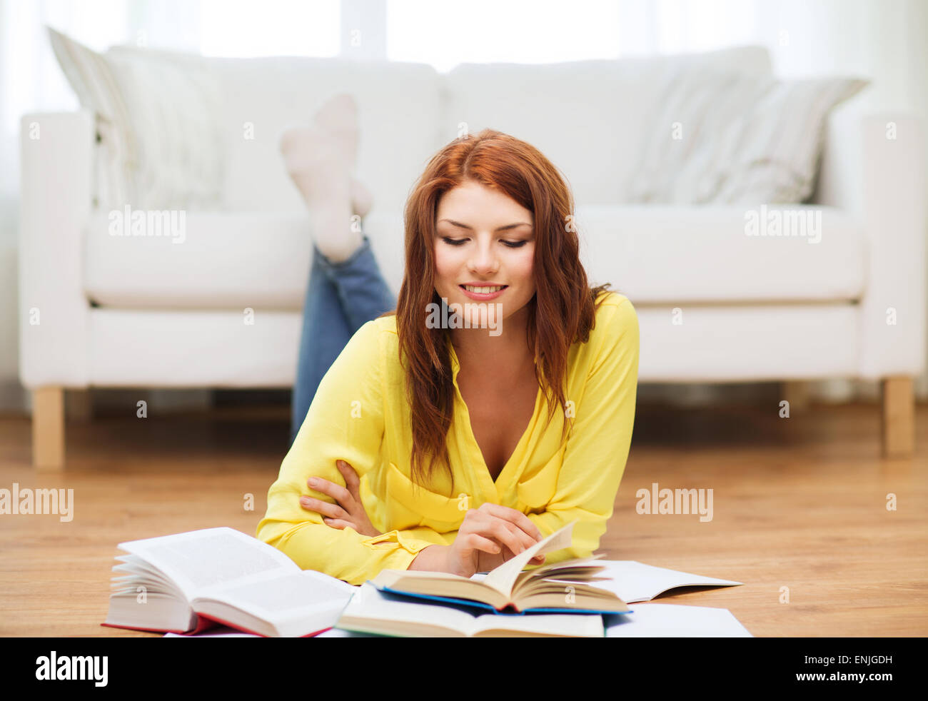 smiling student girl reading books at home Stock Photo - Alamy