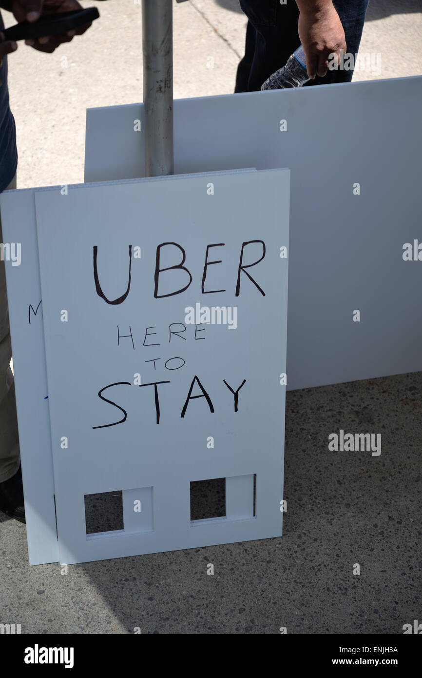 Toronto, Canada. 6th May, 2015. Nathan Phillips Square was the scene for the gathering of 100+ Uber supporters, organized in a semi-circle, chanting “Make Uber here to stay! Don’t let it go away!” and other various pro-Uber statements. Credit:  NISARGMEDIA/Alamy Live News Stock Photo