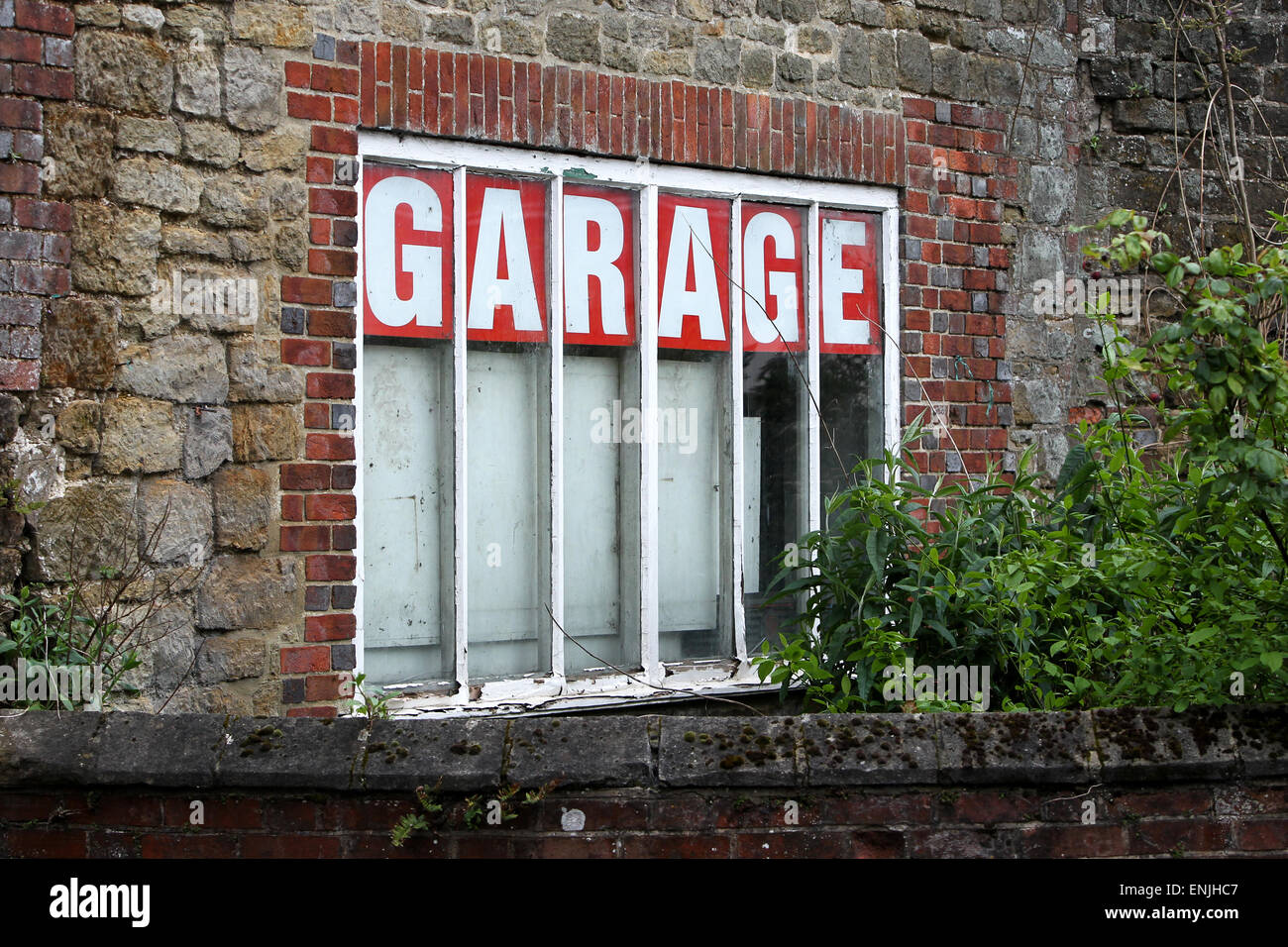 Old fashioned car garage sign in Petworth, West Sussex, UK. Stock Photo