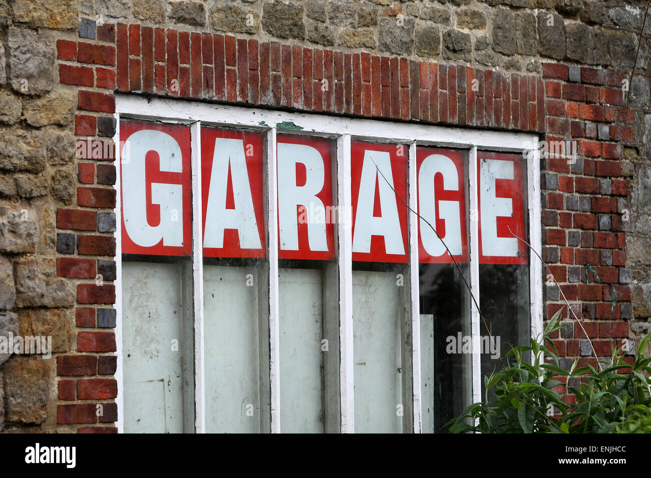 Old fashioned car garage sign in Petworth, West Sussex, UK. Stock Photo
