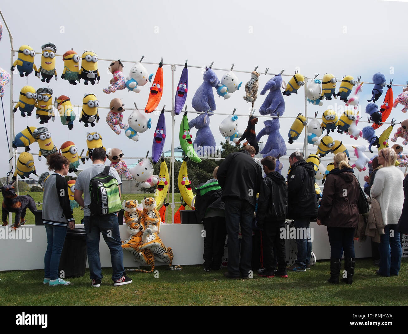 A tombola ticket stall at a fairground with cuddly toy prizes Stock Photo