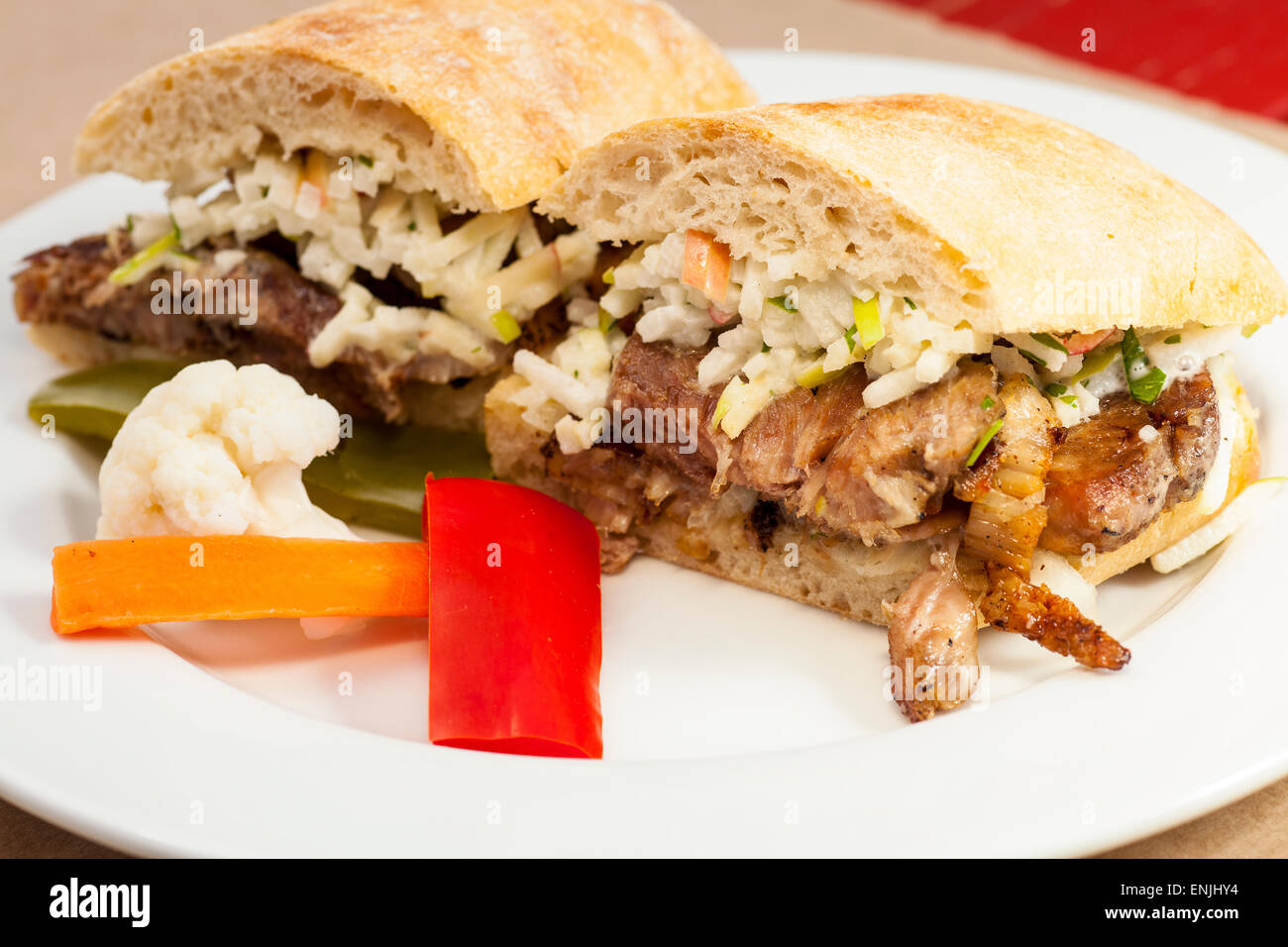 crispy rotisserie pork sandwich with pickled vegetables, Bell Street Farm deli, Los Alamos, California Stock Photo