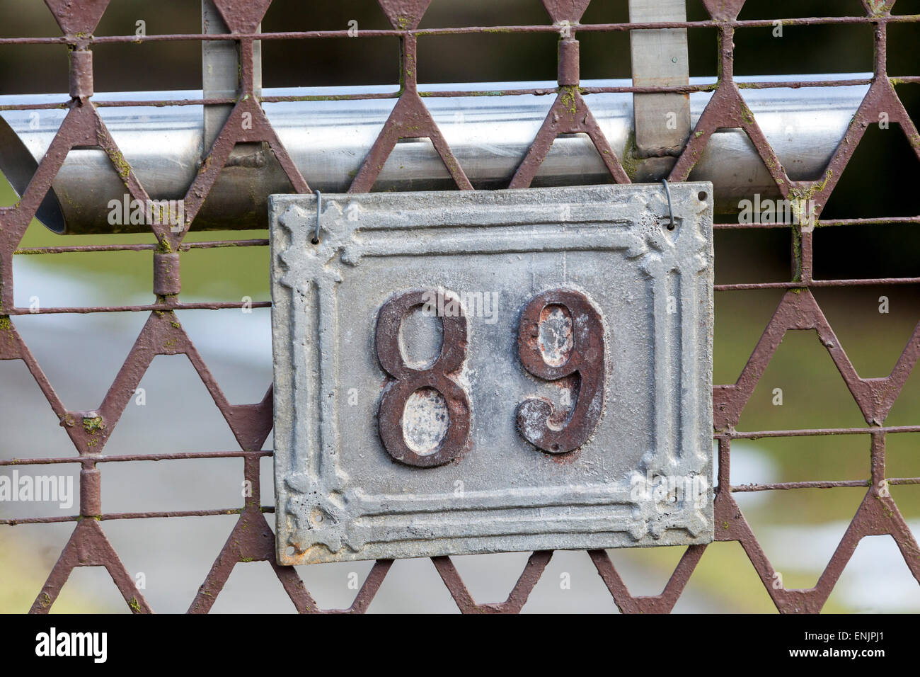 Number 89 on the iron fence, letterbox Stock Photo