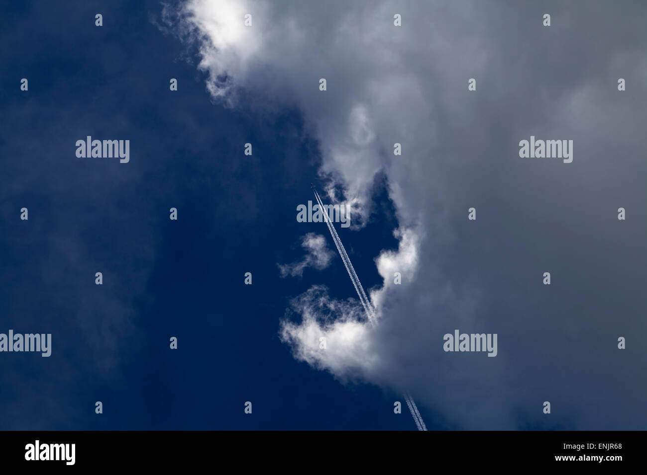 airplane on blue sky with clouds Stock Photo - Alamy