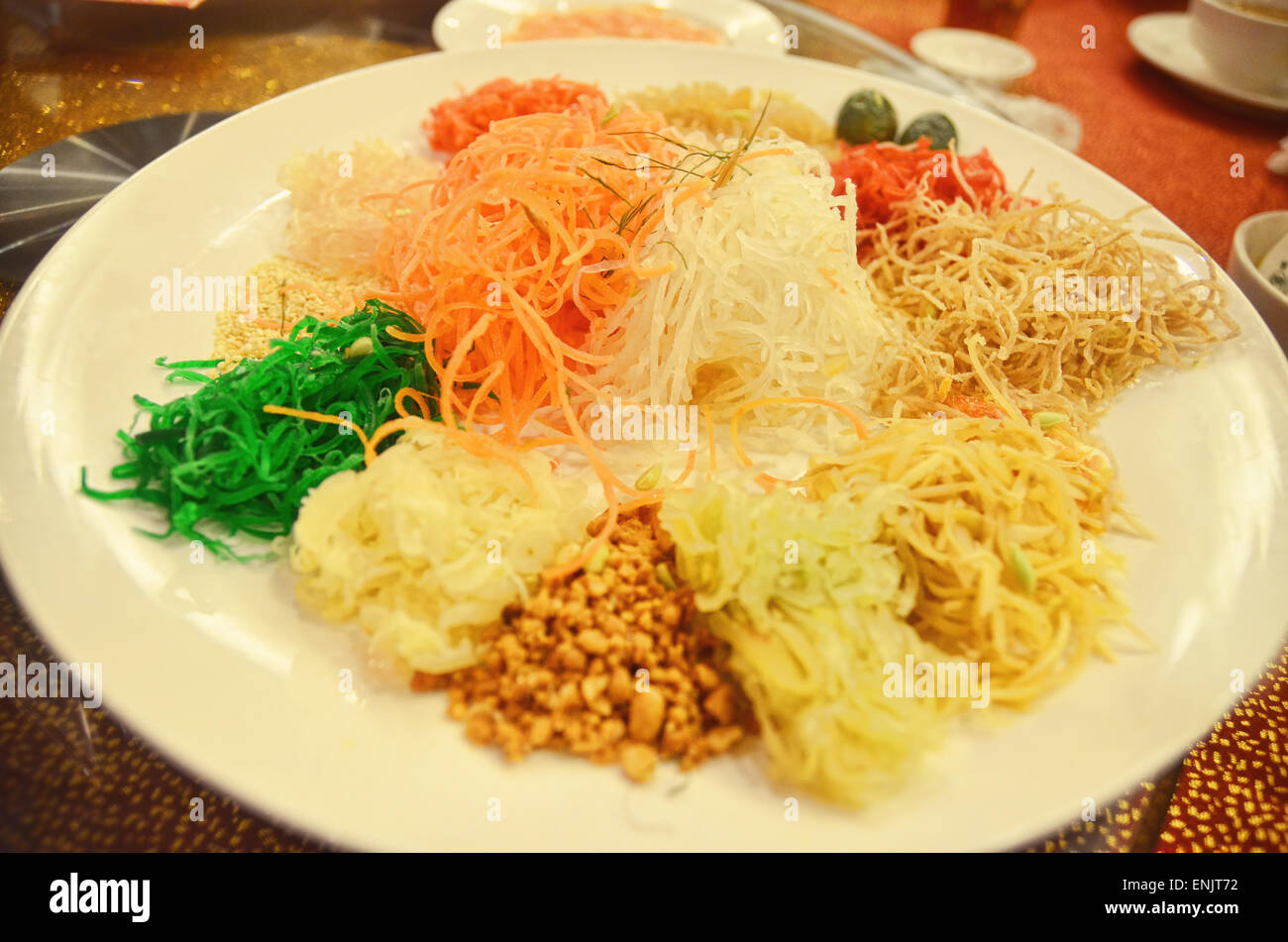 A plate of Yusheng (Prosperity Toss) to celebrate Chinese New Year in South East Asian countries Stock Photo