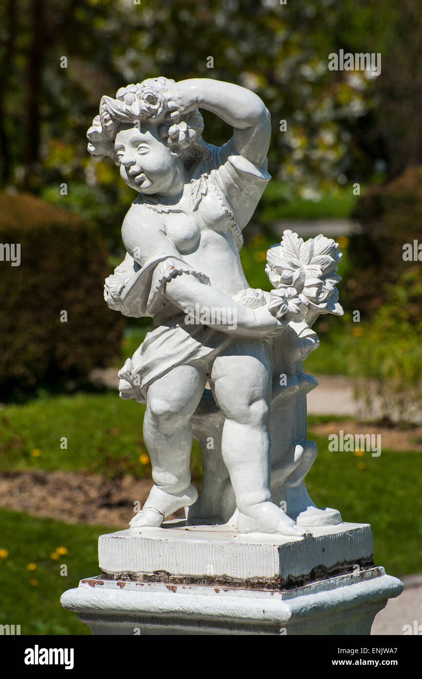 Clay statue of a boy with flowers, botanical garden, Munich, Upper Bavaria, Bavaria, Germany Stock Photo