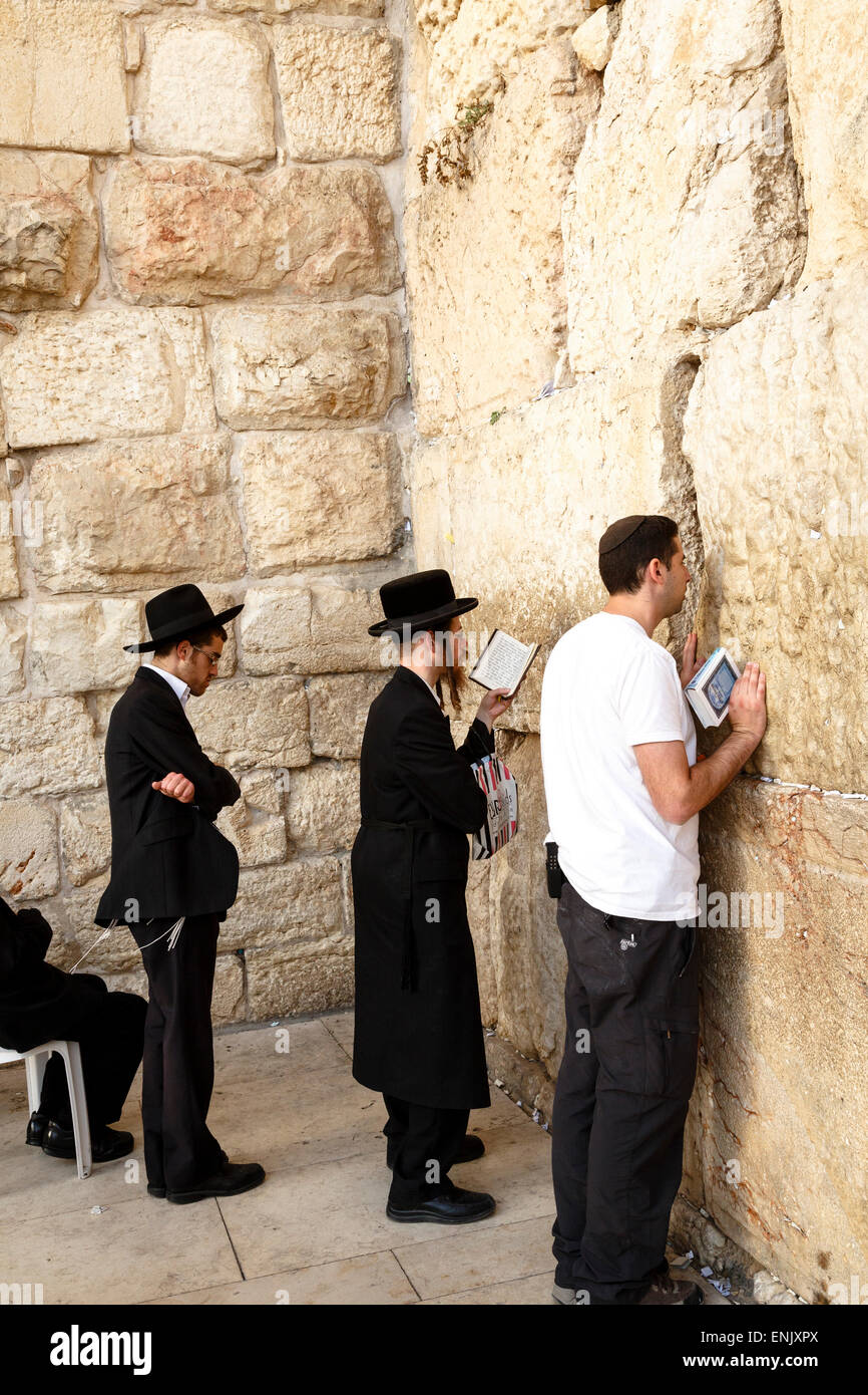 Orthodox Jewish people praying at the Western Wall (Wailing Wall), Jerusalem, Israel, Middle East Stock Photo