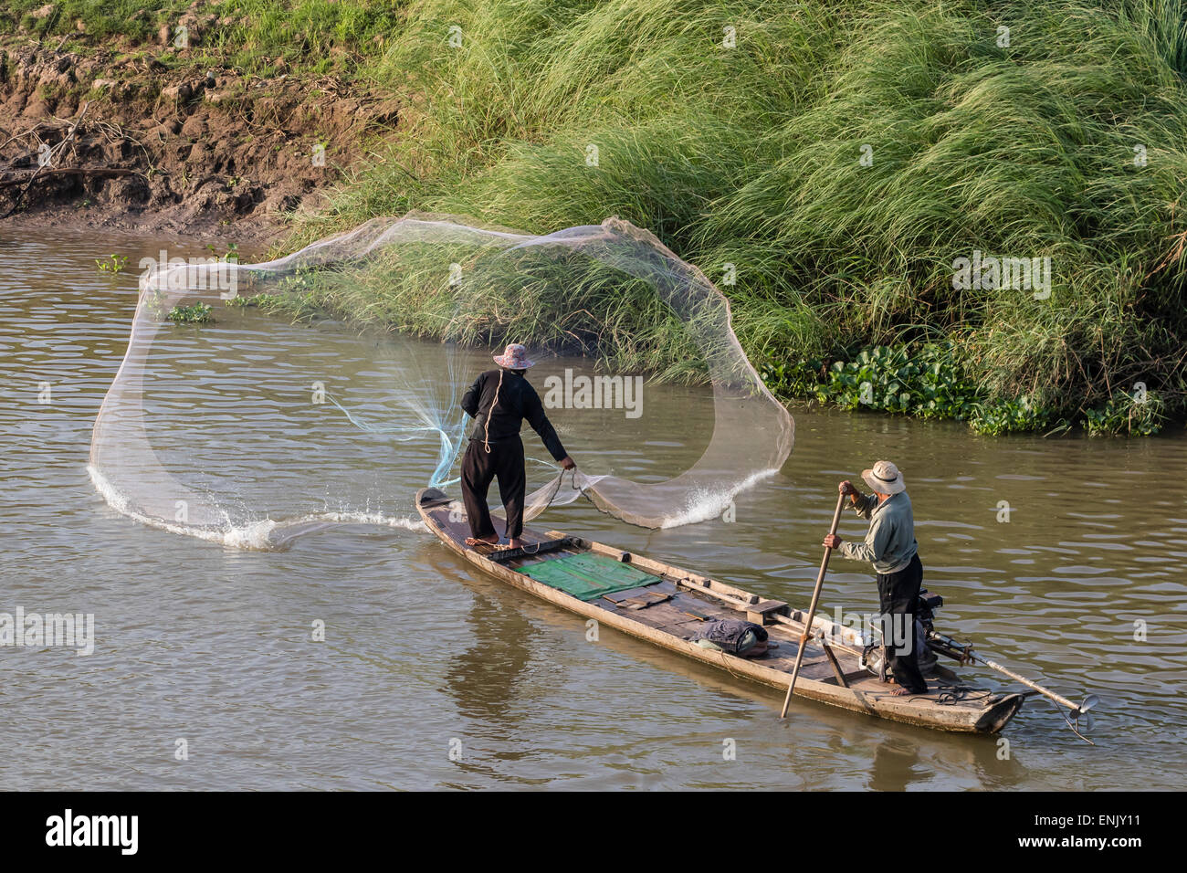 Man casting net on the Tonle Sap River near Phnom Penh, Cambodia, Indochina, Southeast Asia, Asia Stock Photo