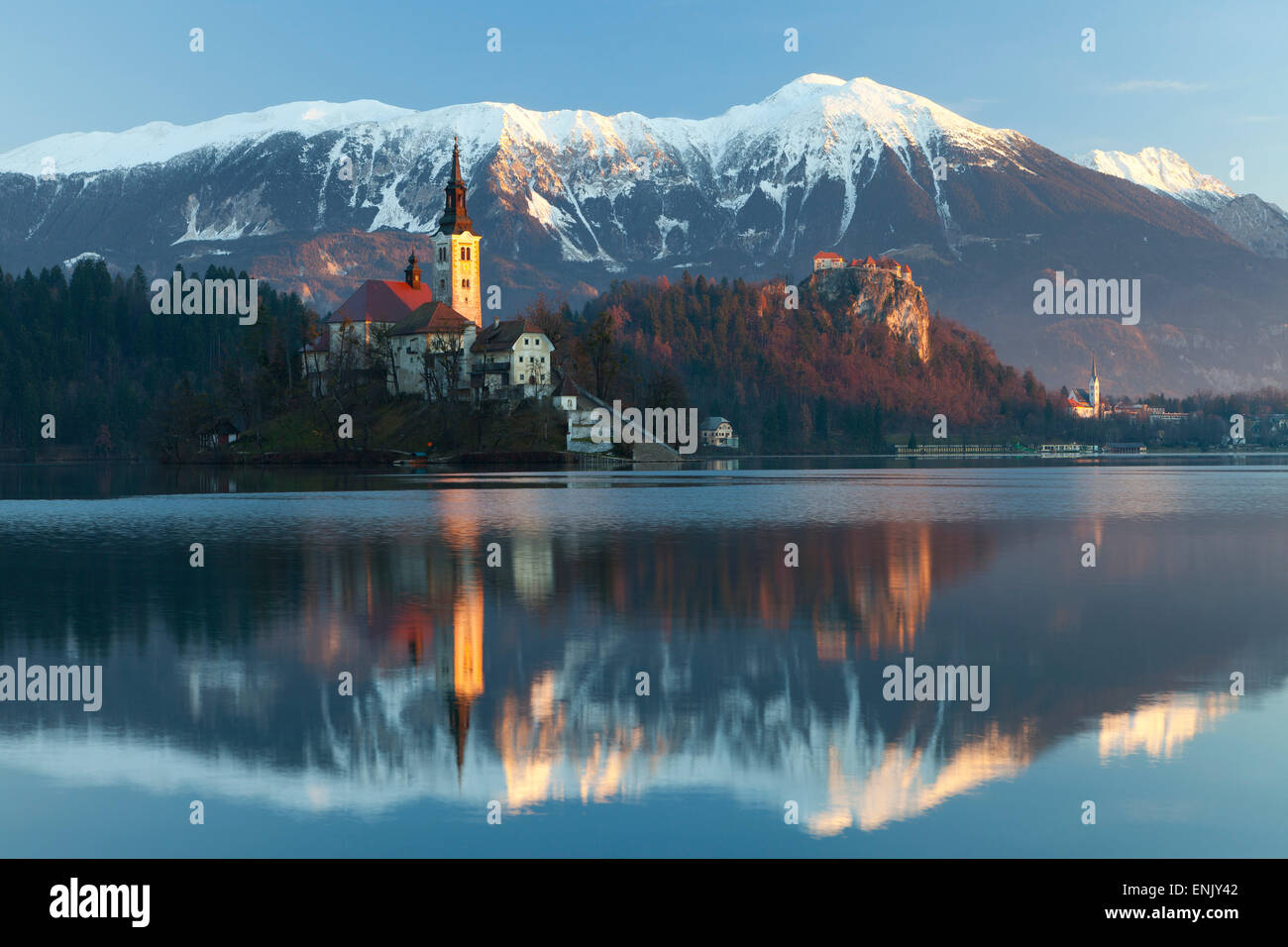 The Assumption of Mary Pilgrimage Church on Lake Bled and Bled Castle, Bled, Slovenia, Europe Stock Photo