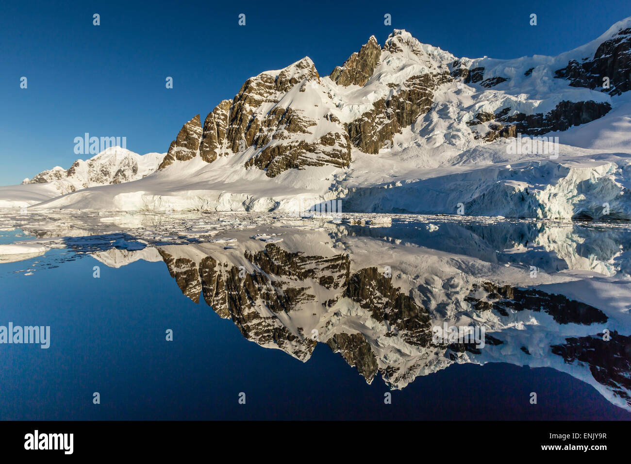 Reflections in the calm waters of the Lemaire Channel, Antarctica, Polar Regions Stock Photo