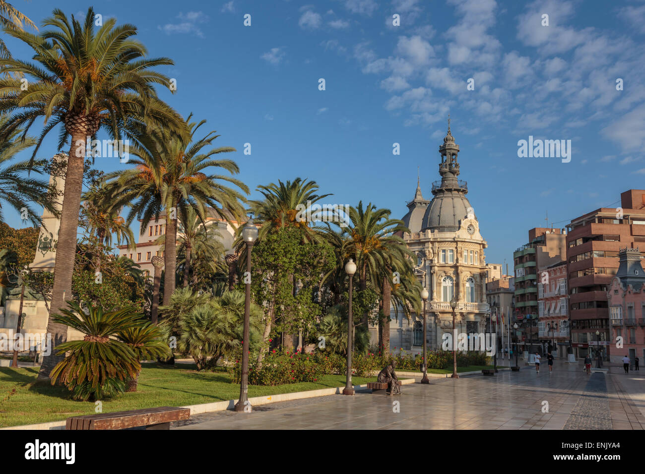 Town Hall under a cloud dappled blue sky with palm trees and roses, Cartagena, Murcia Region, Spain, Europe Stock Photo