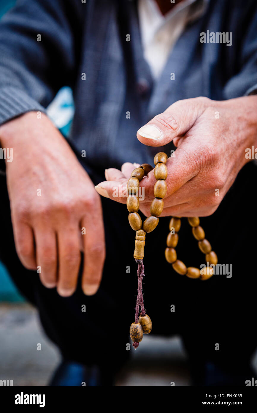 Hands holding worry beads, Bethlehem, West Bank, Palestine territories, Israel, Middle East Stock Photo