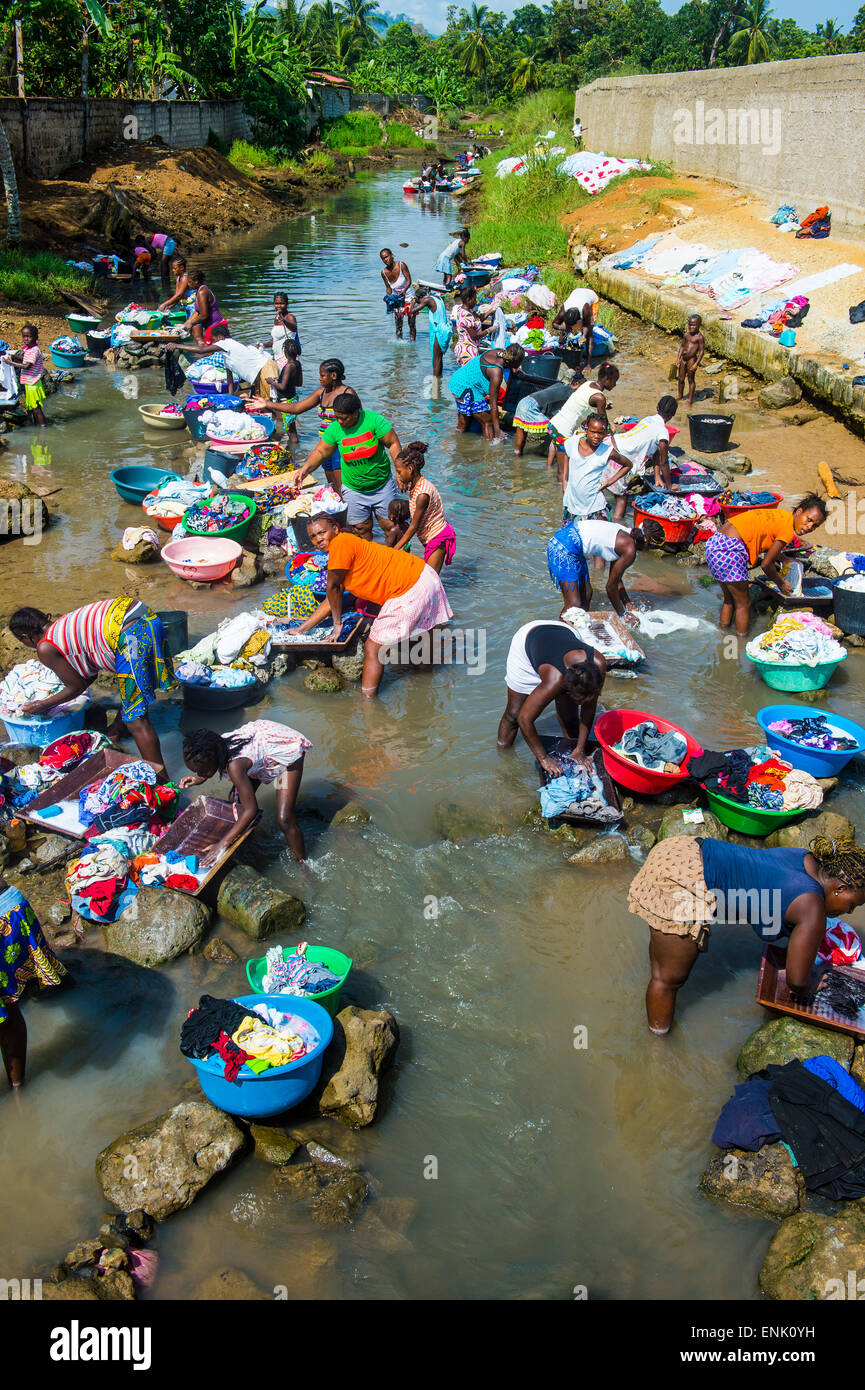 Women washing clothes in a river bed, City of Sao Tome, Sao Tome and Principe, Atlantic Ocean, Africa Stock Photo