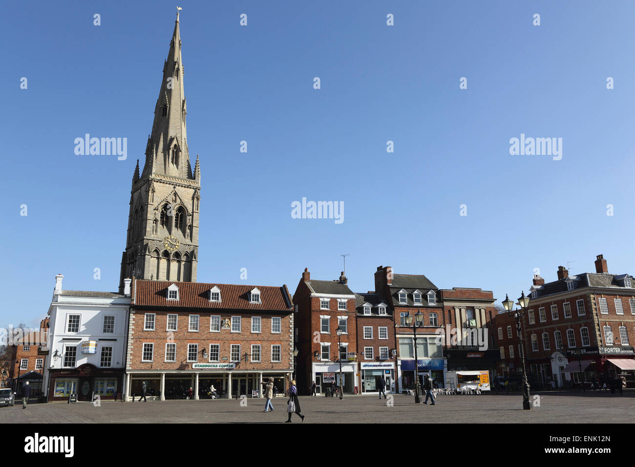 The spire of St. Mary Magdalene church rises over building on the Market Square in Newark-upon-Trent, Nottinghamshire, England Stock Photo
