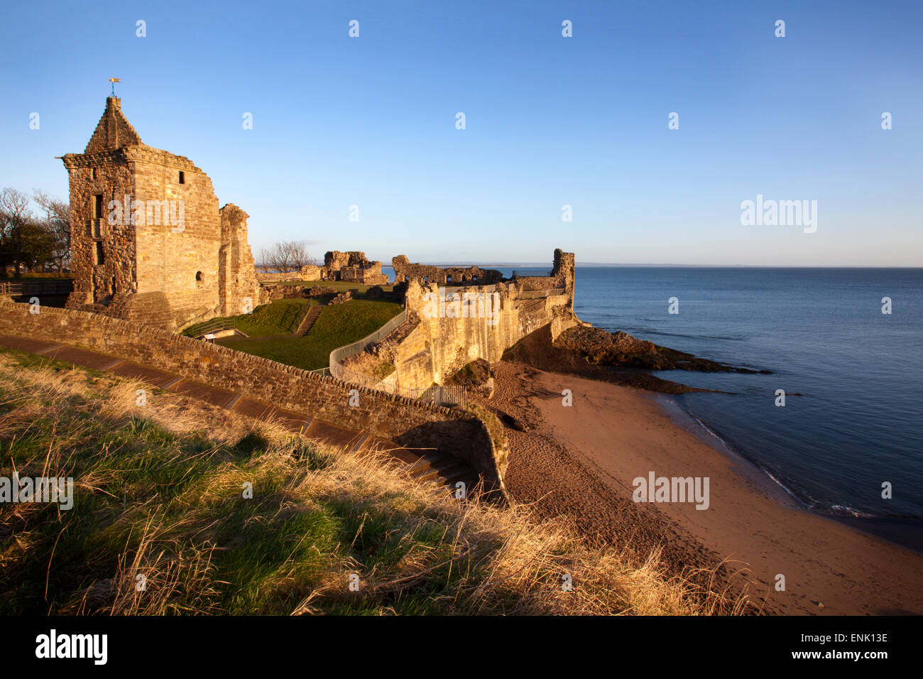 St. Andrews Castle and Castle Sands from The Scores at sunrise, Fife, Scotland, United Kingdom, Europe Stock Photo