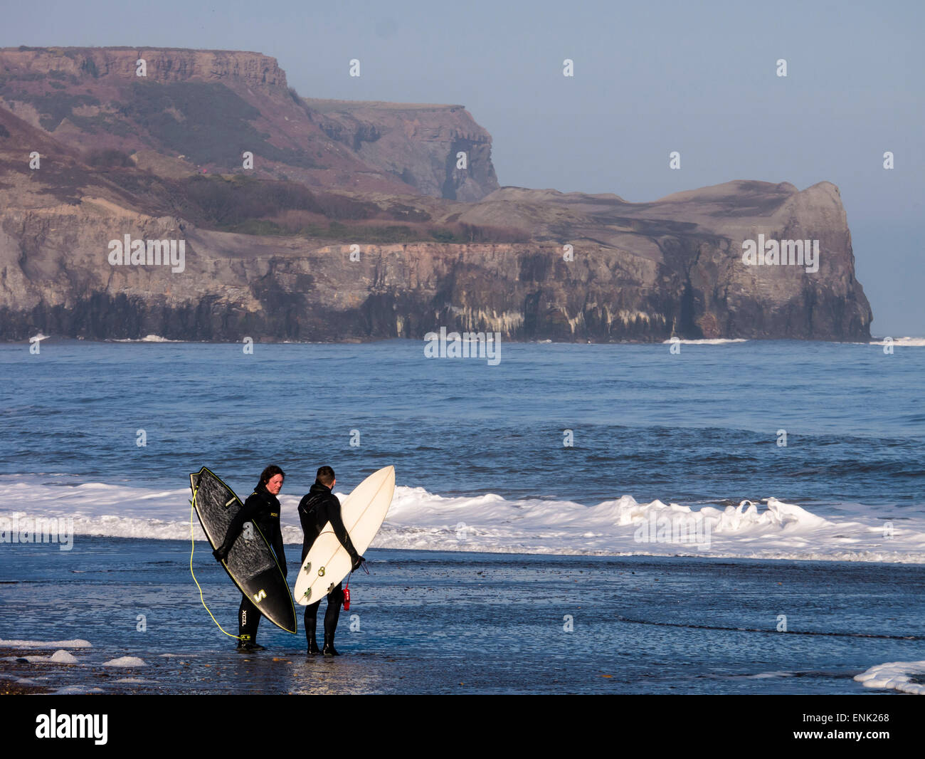 Surfers at Sandsend near Whitby, North Yorkshire Stock Photo