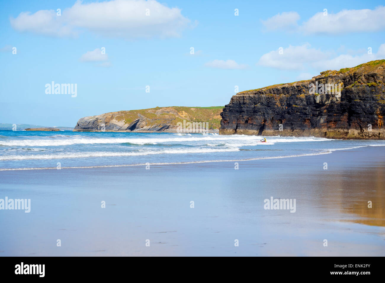 bright winter view of kayaker at ballybunion beach and cliffs on the wild atlantic way in ireland Stock Photo