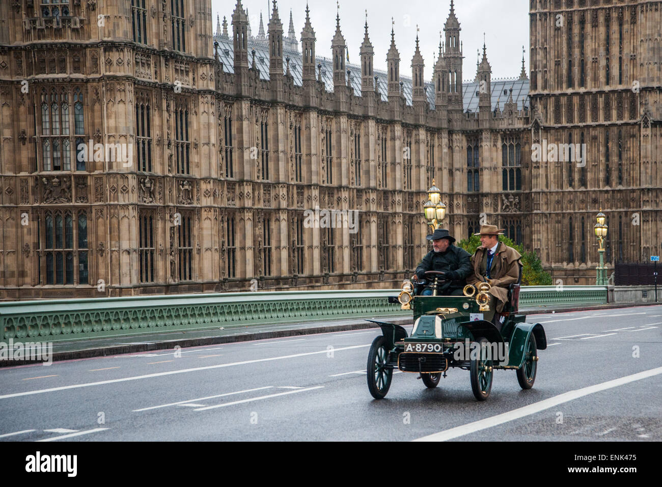 Vintage motor cars race across Westminster Bridge during the Bonhams London to Brighton Veteran Car Run.  Featuring: Paul Hollywood,Contestant Where: London, United Kingdom When: 02 Nov 2014 Stock Photo