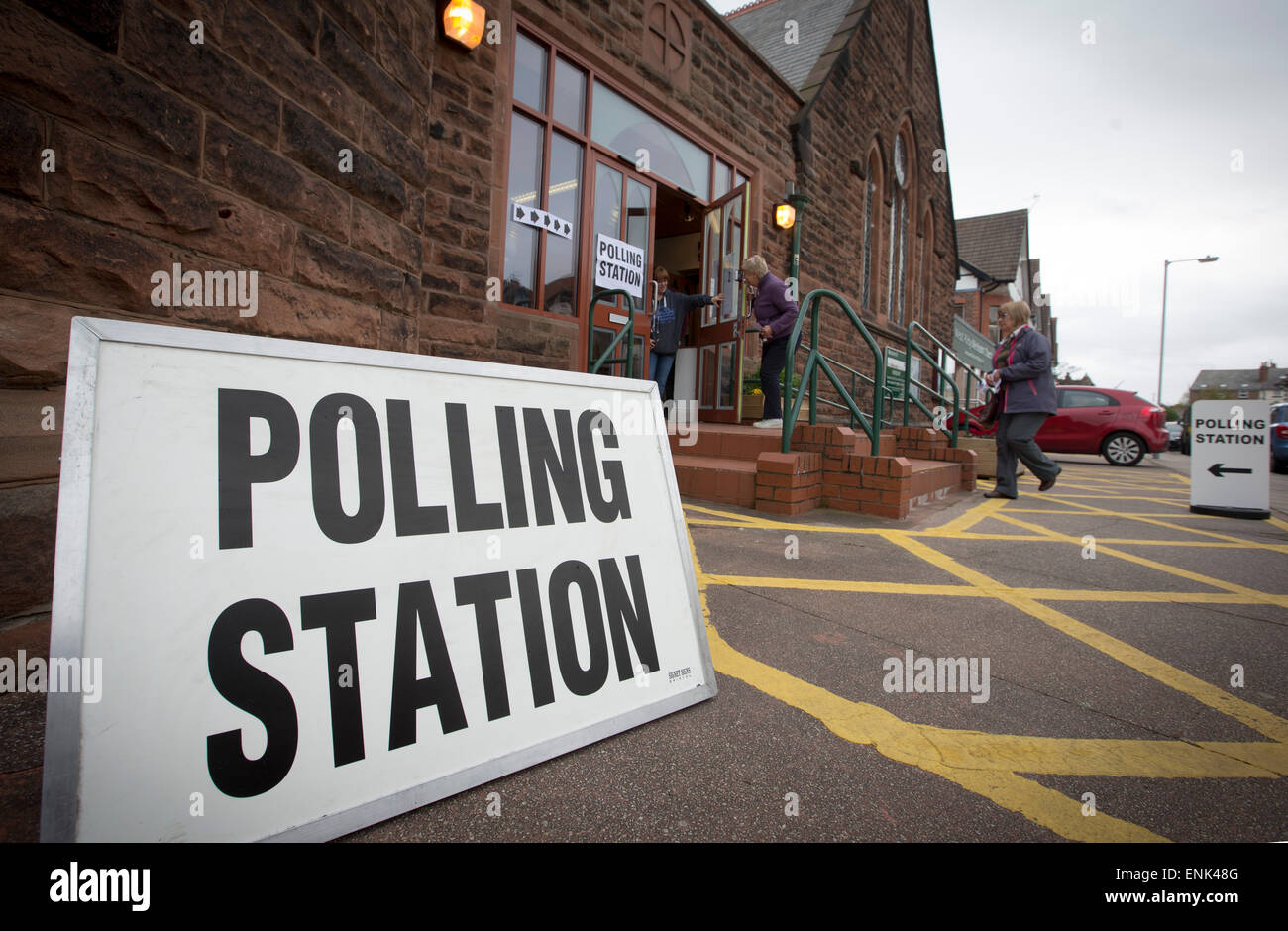 Voters arriving at a polling station in West Kirby, Wirral to cast
