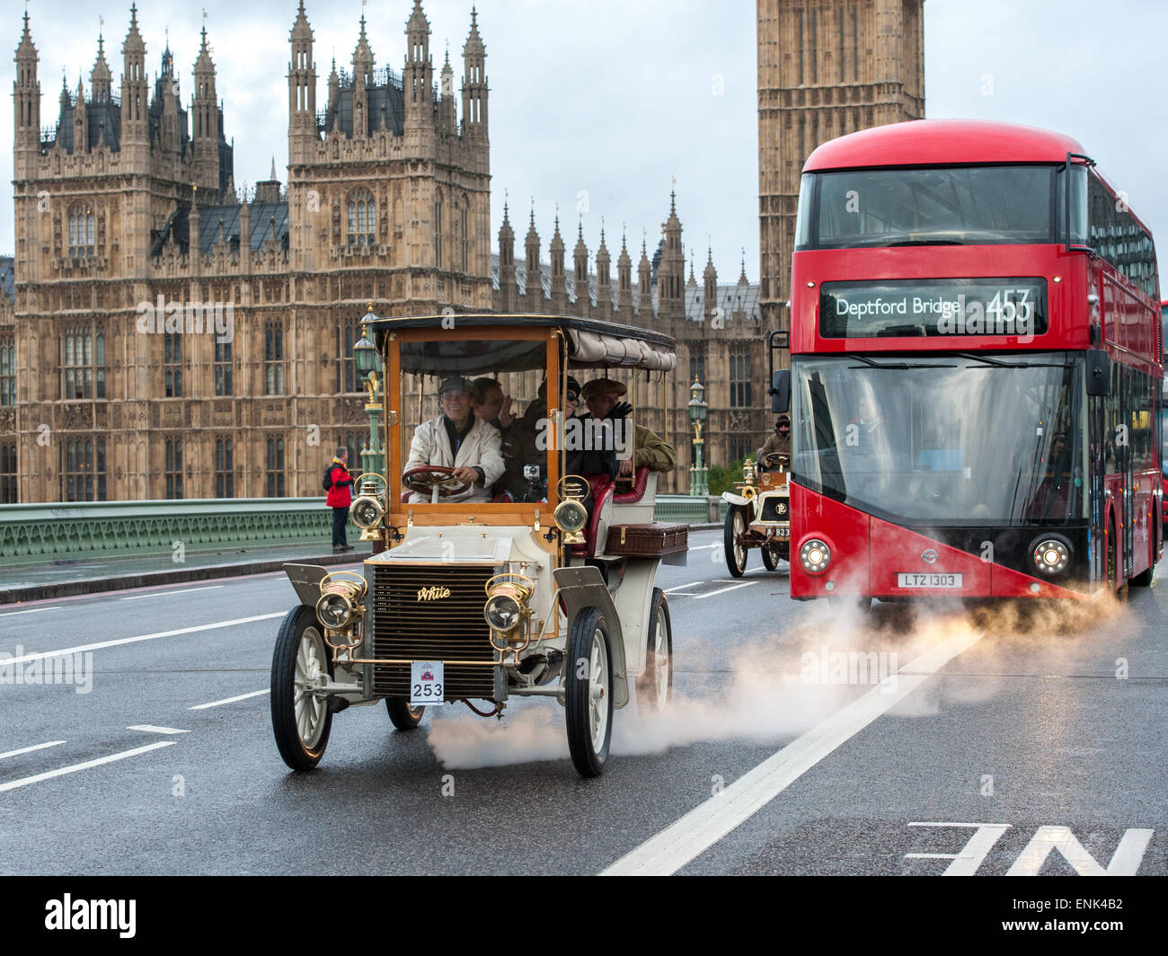 Vintage motor cars race across Westminster Bridge during the Bonhams London to Brighton Veteran Car Run.  Featuring: View,Contestant Where: London, United Kingdom When: 02 Nov 2014 Stock Photo