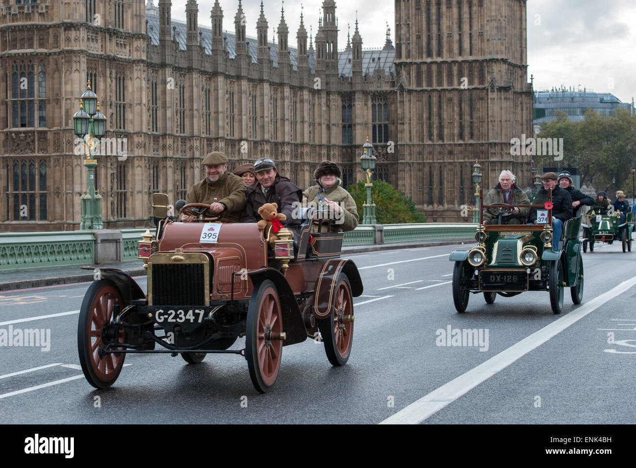Vintage motor cars race across Westminster Bridge during the Bonhams London to Brighton Veteran Car Run.  Featuring: View,Contestant Where: London, United Kingdom When: 02 Nov 2014 Stock Photo