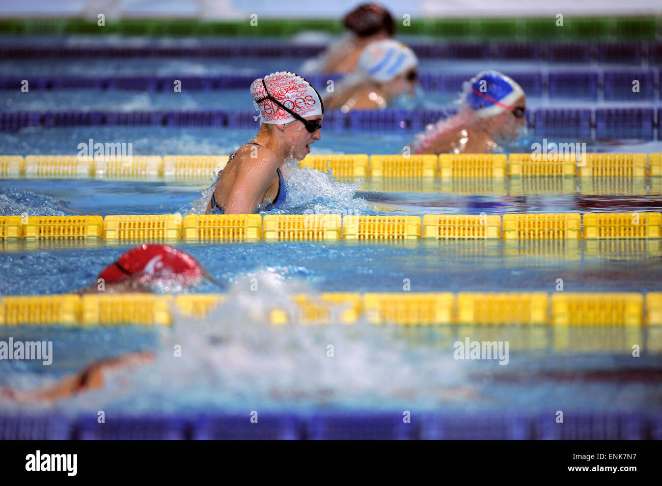 Young women competing during a breaststroke swimming race Stock Photo