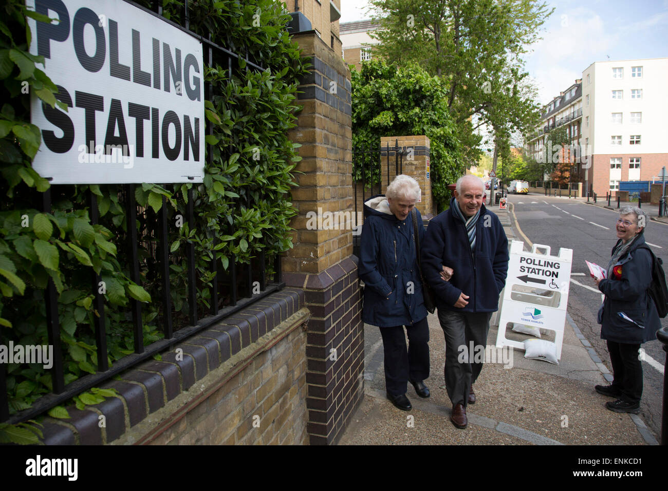 London, UK. 7th May, 2015. Voters attending a polling station at St Peter's London Docks Primary School in the constituency of  Poplar and Limehouse in East London on the day of the general election. This is a Labour Party seat, although this electin is set to be one of the most hotly contested in a generation. Credit:  Michael Kemp/Alamy Live News Stock Photo
