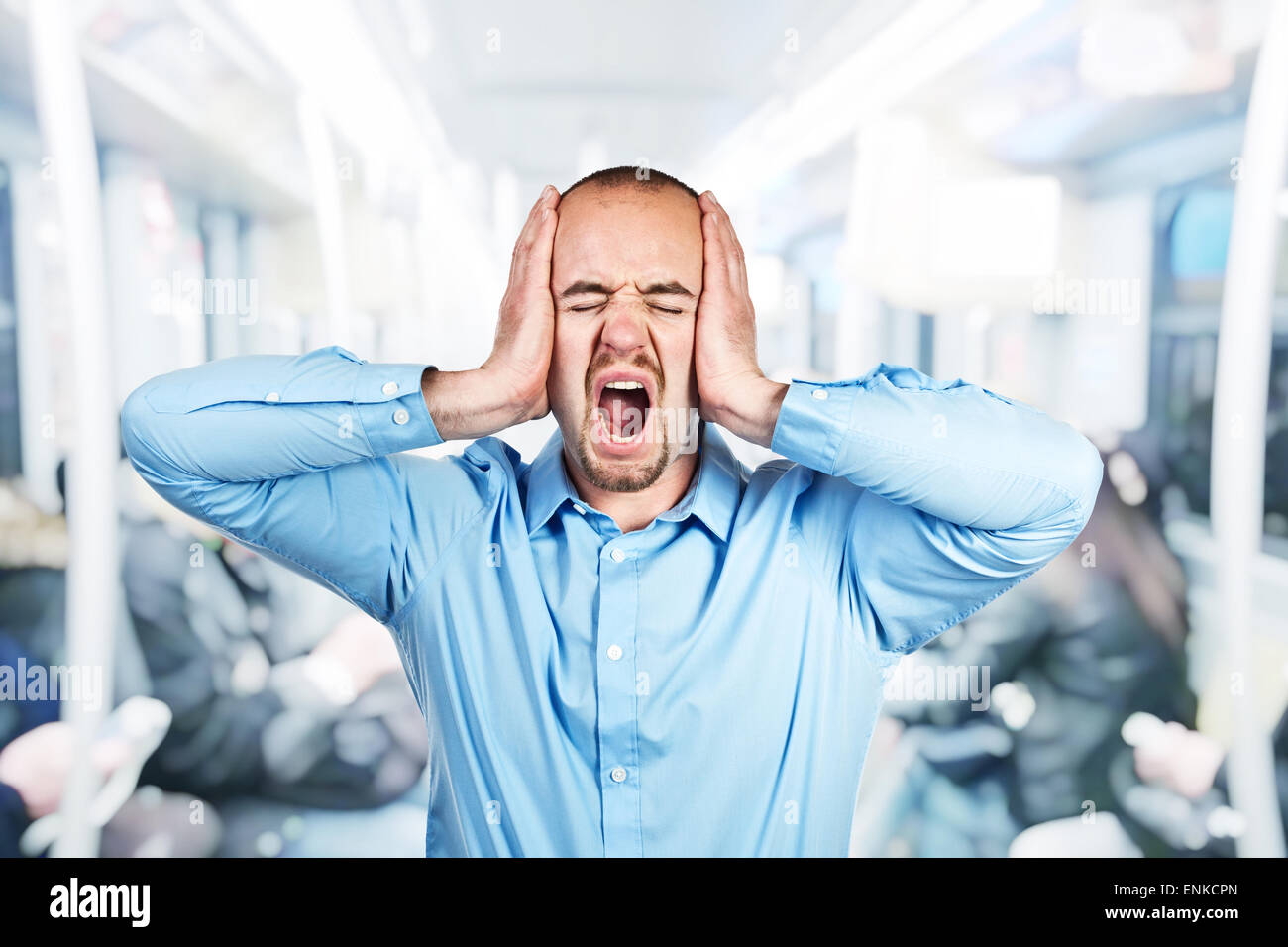 stressed man on urban train Stock Photo