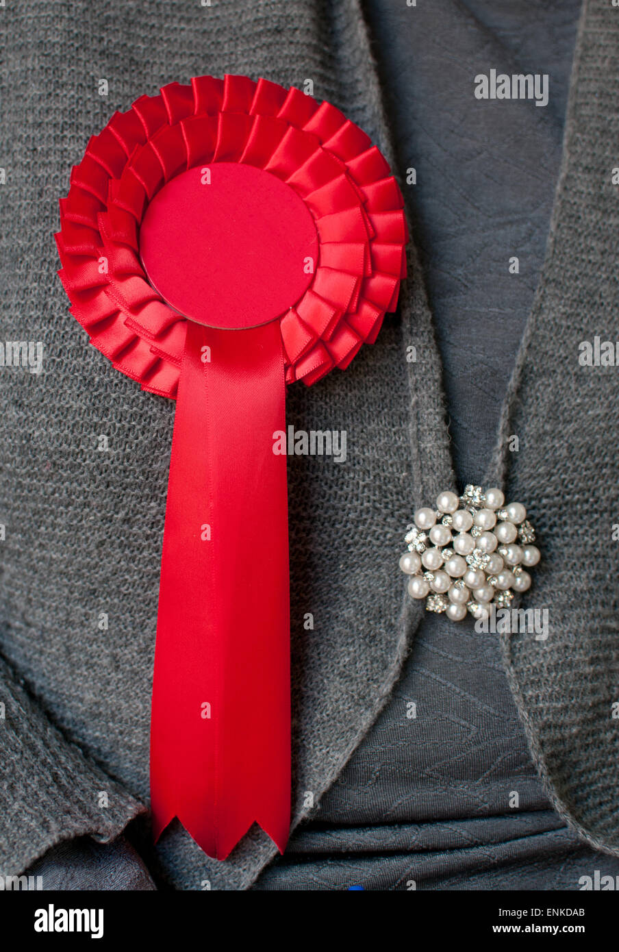 Rosette for each party. Blue for conservative, Red For Labour, Orange for Liberal Democrats. Stock Photo