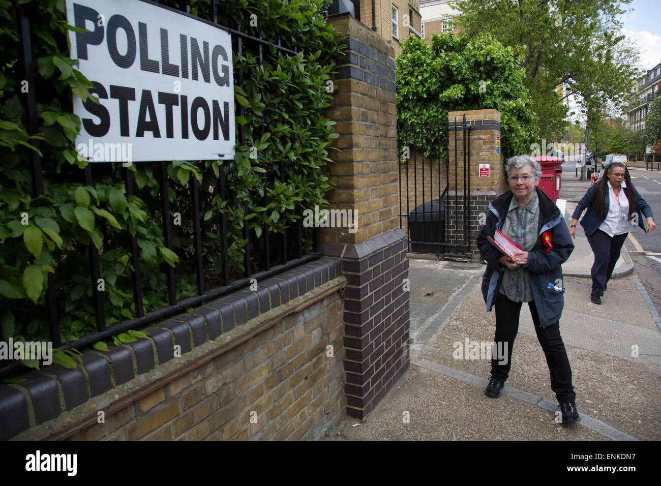 London, UK. Thursday 7th May 2015. Voters attending a polling station at St Peter's London Docks Primary School in the constituency of  Poplar and Limehouse in East London on the day of the general election. This is a Labour Party seat, although this electin is set to be one of the most hotly contested in a generation. Stock Photo