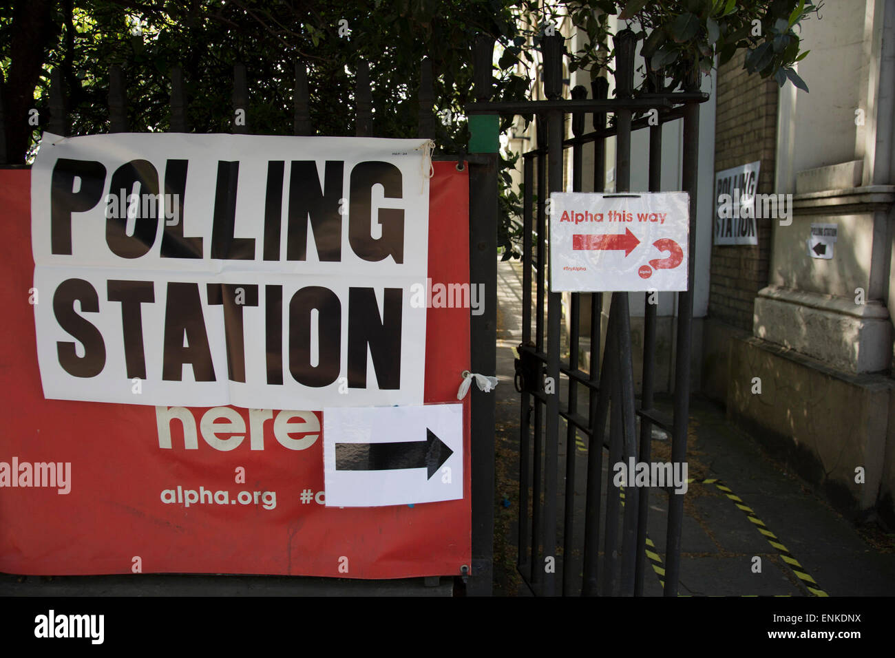 London, UK. Thursday 7th May 2015. Voters attending a polling station at St Pauls Institute in the constituency of  Poplar and Limehouse in East London on the day of the general election. This is a Labour Party seat, although this electin is set to be one of the most hotly contested in a generation. Stock Photo