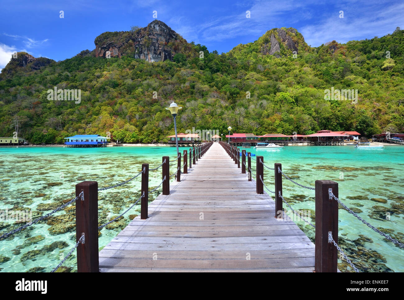 Long wooden pier heading toward Bohey Dulang Island in Sabah Borneo Malaysia. Stock Photo