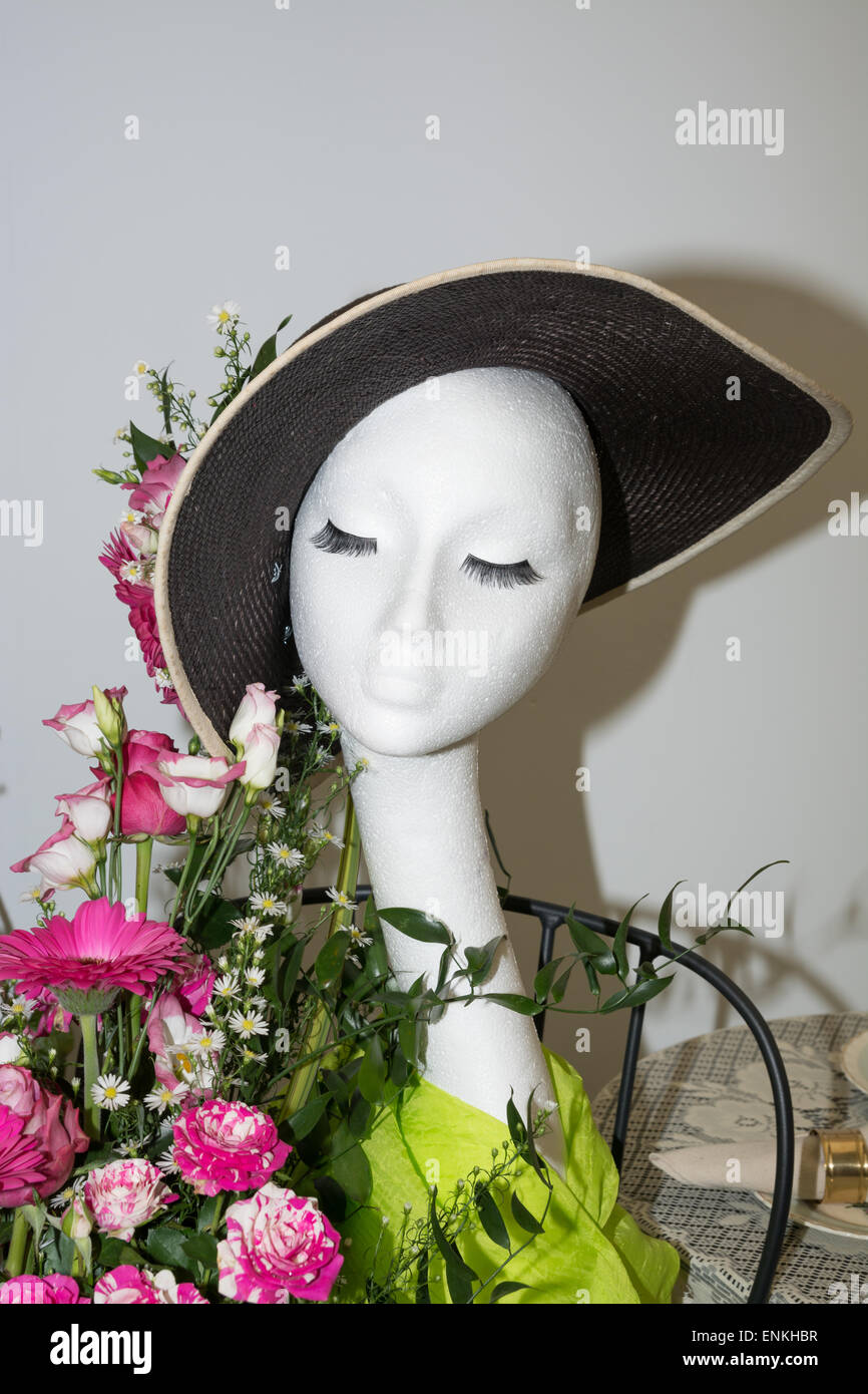 Hat on mannequin with floral display Stock Photo Alamy