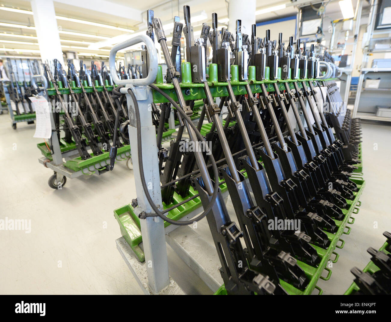 Oberndorf, Germany. 07th May, 2015. Heckler & Koch G36 assault rifles have been lined up for maintenance at the headquarters of the weapons manufacturer in Oberndorf, Germany, 07 May 2015. The ongoing controversy surrounding the G36 assault rifle does not pose any threat to the company, Heckler & Koch said. Photo: Bernd Weissbrod/dpa/Alamy Live News Stock Photo