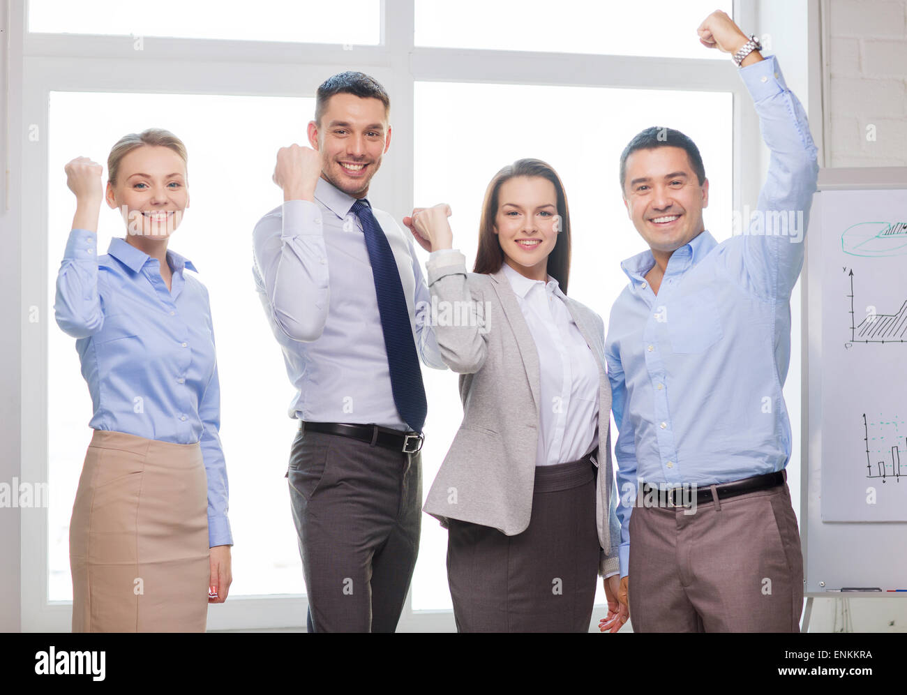 business team celebrating victory in office Stock Photo - Alamy