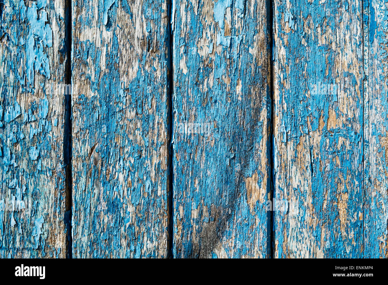 Section of door with peeling blue paint Stock Photo